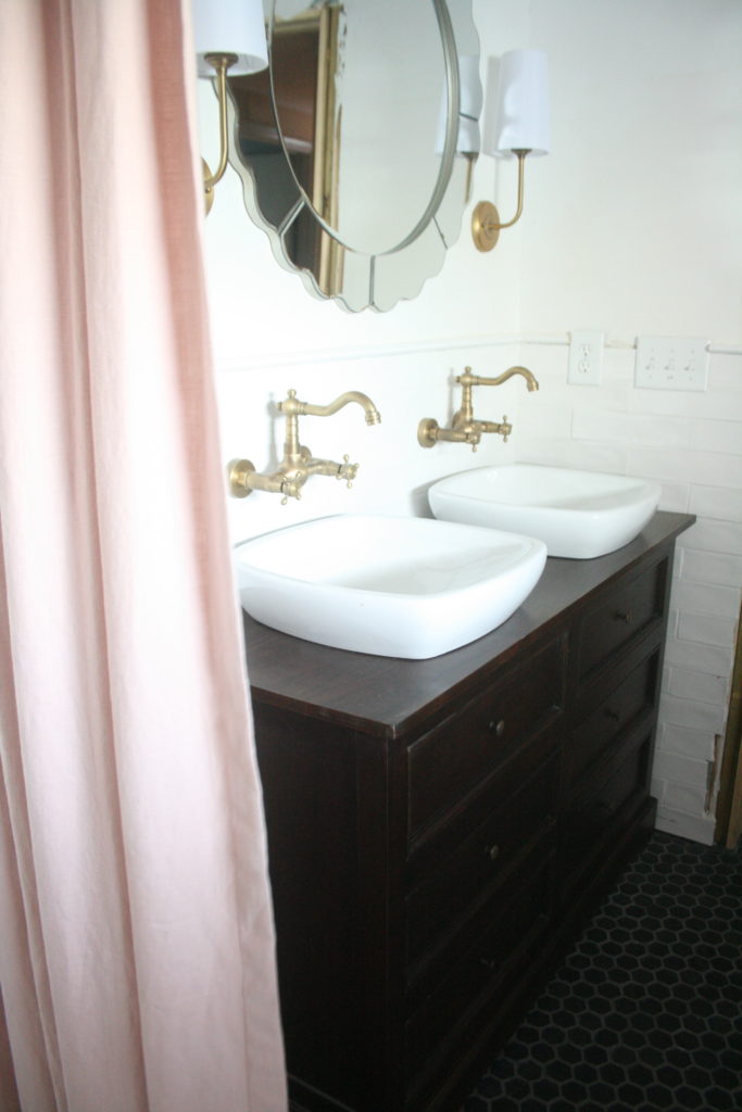 A Bathroom Mirror Over Tile Wainscoting, Hanging Bathroom Mirrors On Tiles
